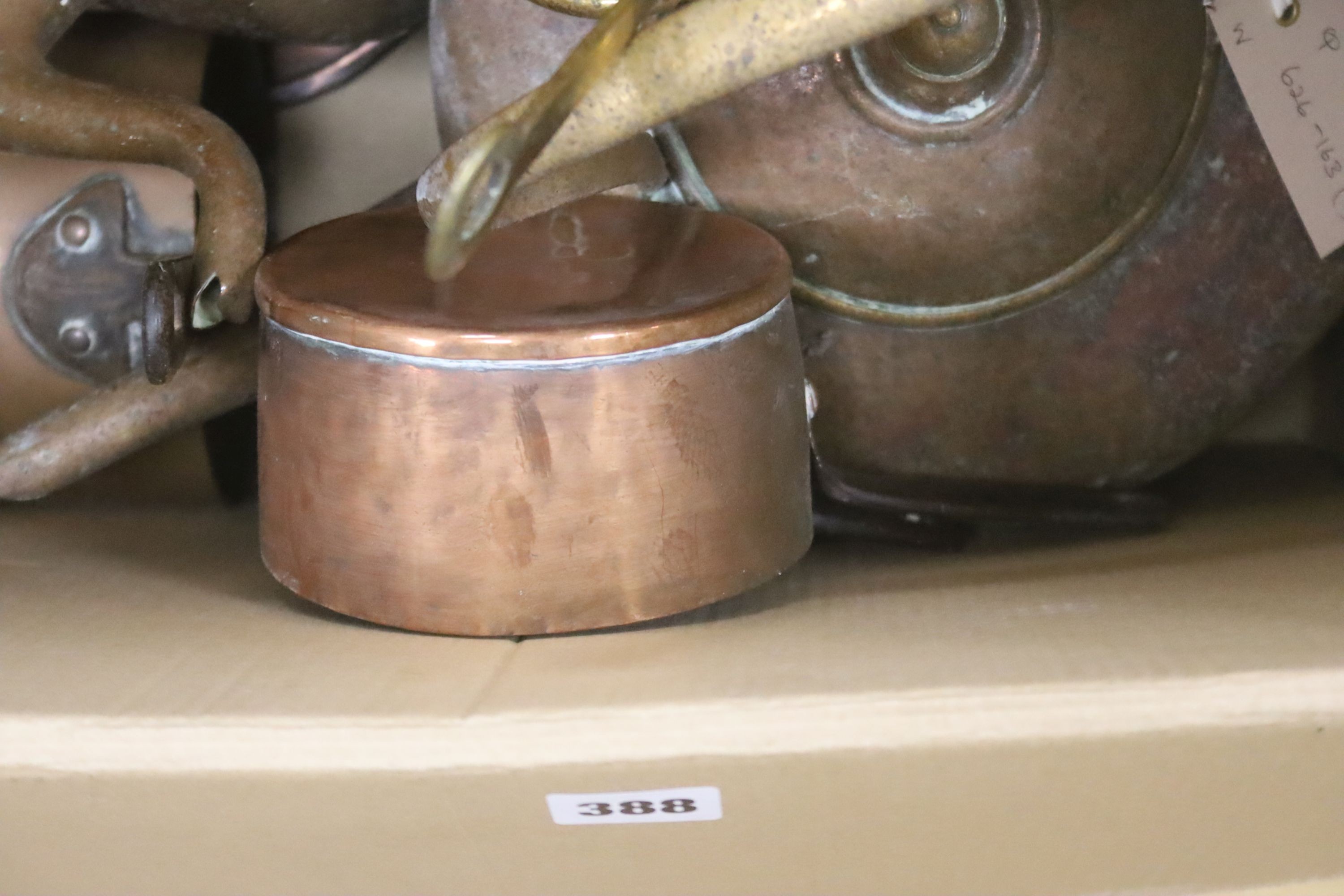 Two copper kettles and a quantity of other copper and brass items, including skimmers, chestnut roaster, etc.